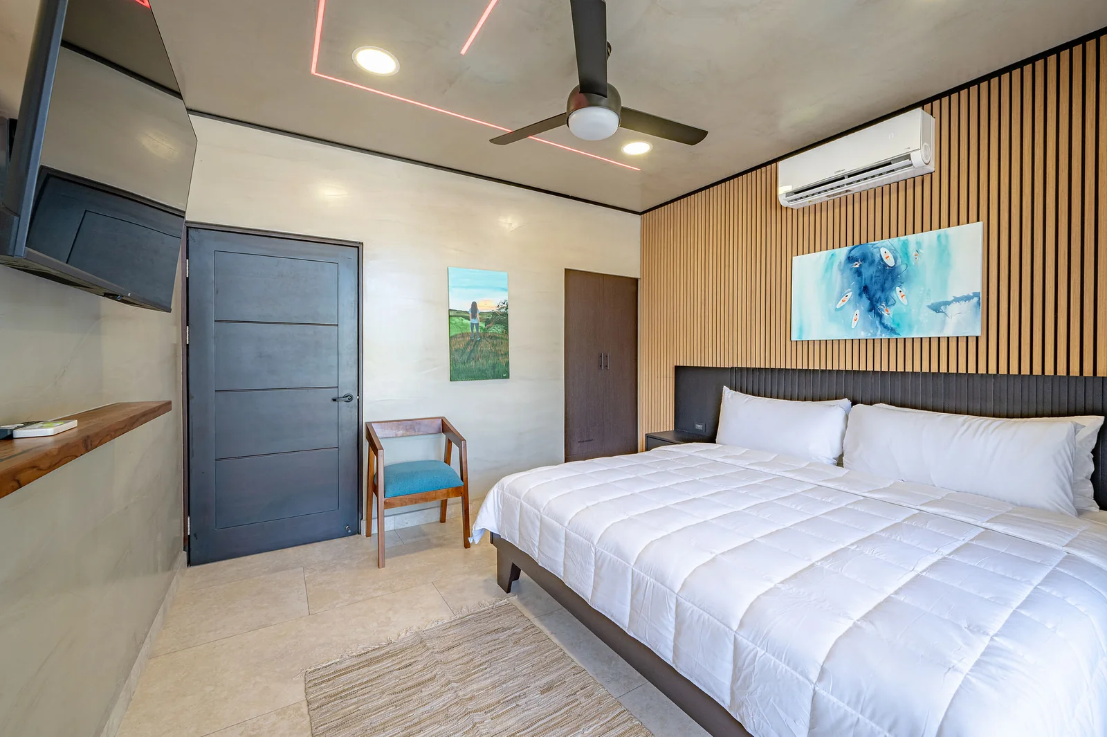 King bedroom with dark slat headboard wall