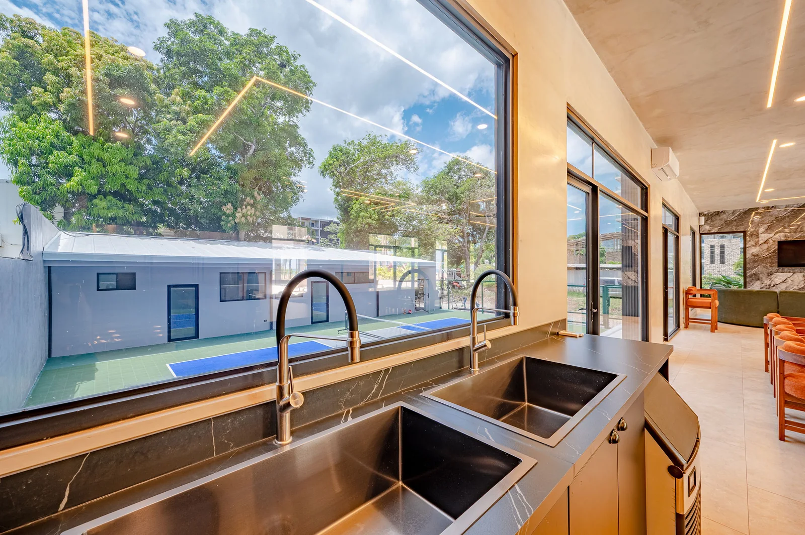 DUAL PREP SINKS WITH A VIEW TO THE PICKLEBALL COURT