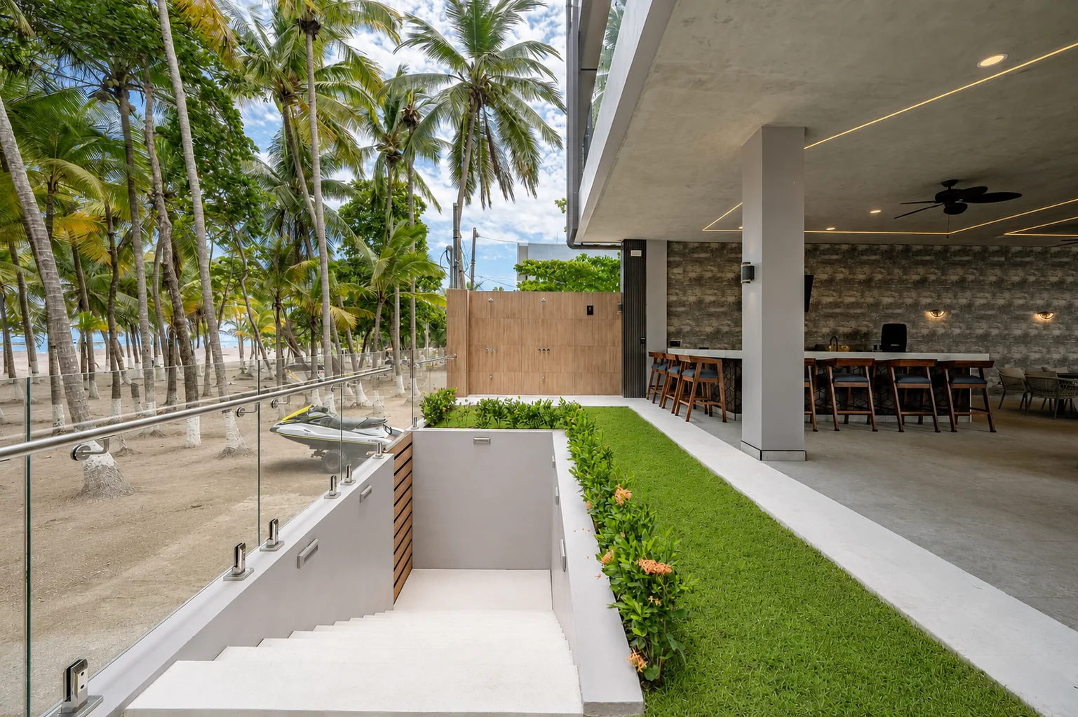 Beachfront lawn and terrace under the palms