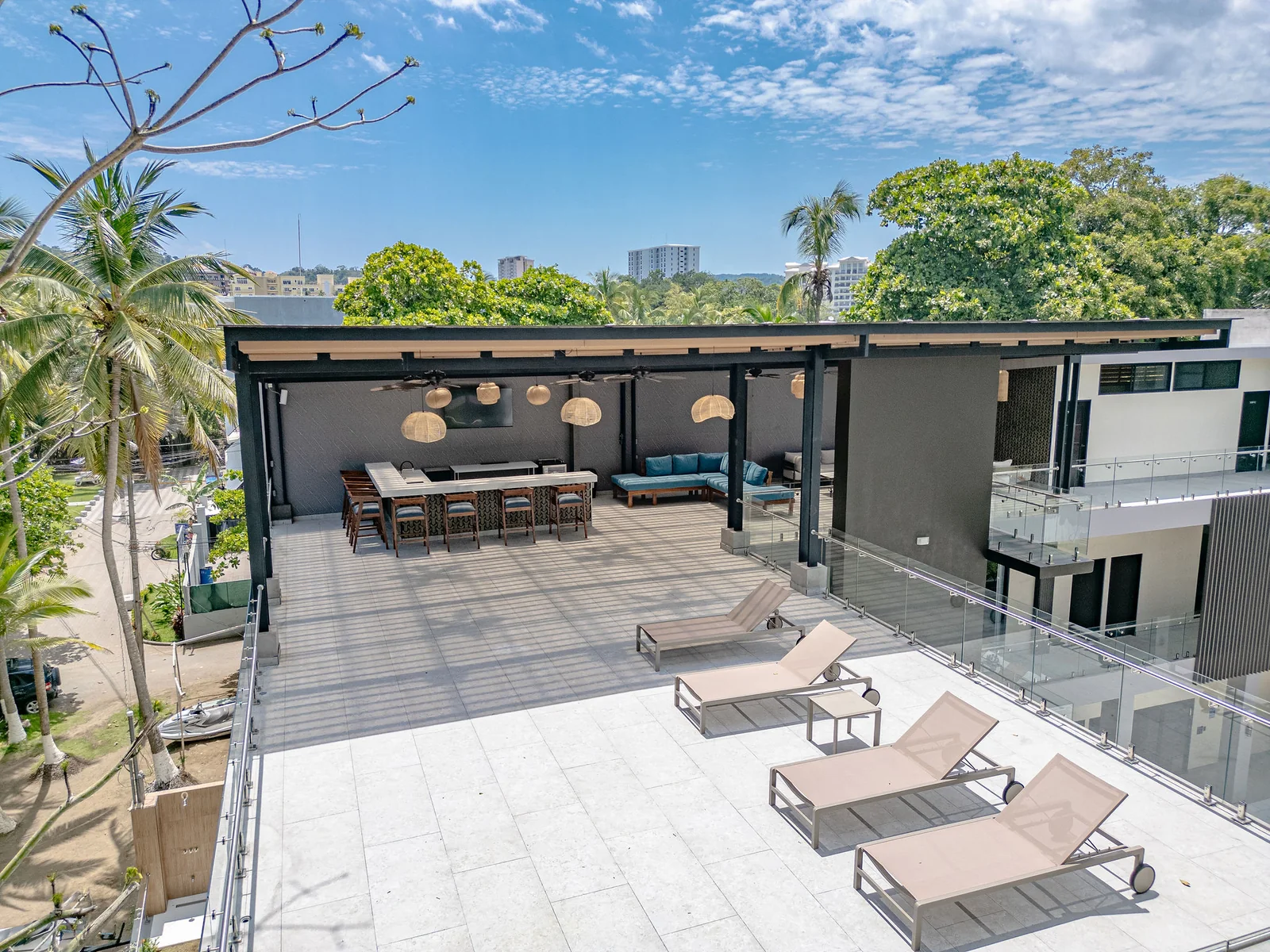 Rooftop terrace surrounded by palms