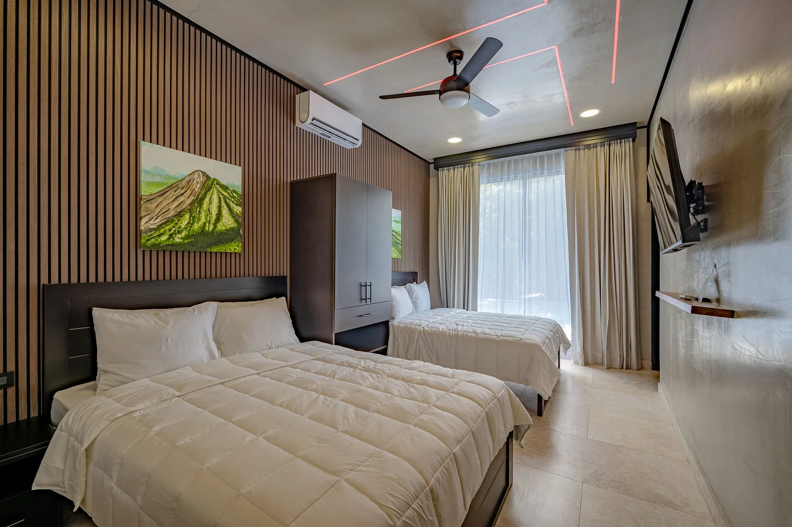 Double-queen bedroom with garden view