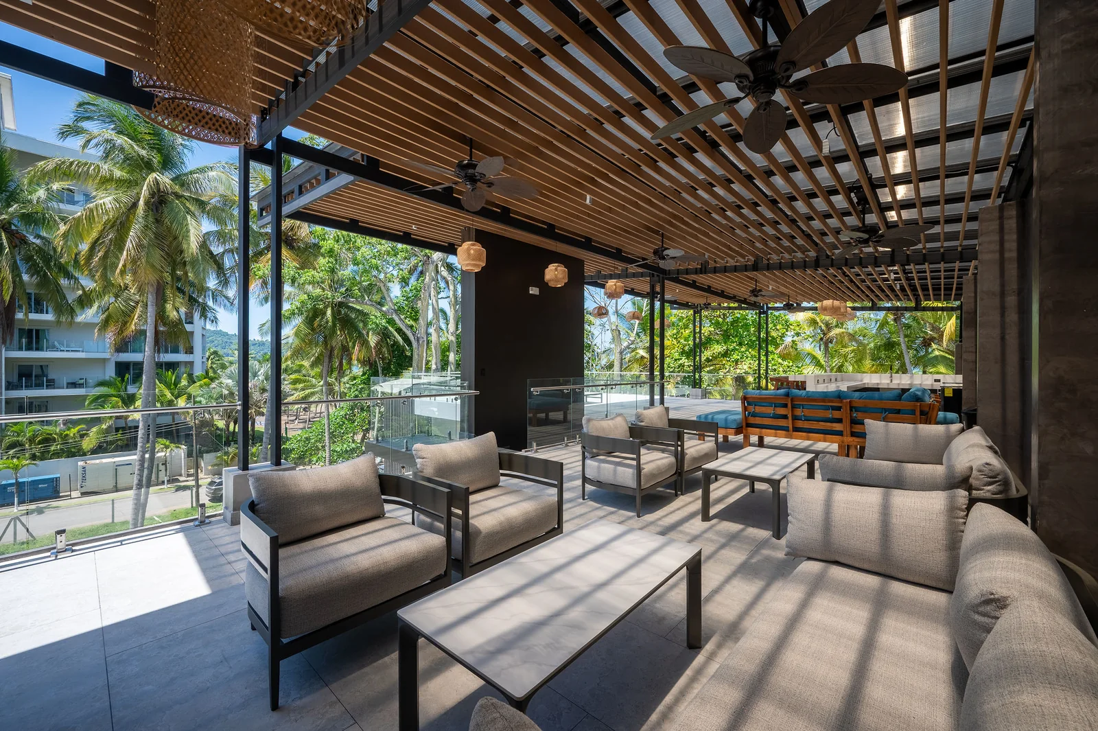 Rooftop seating with ocean breeze and palm views