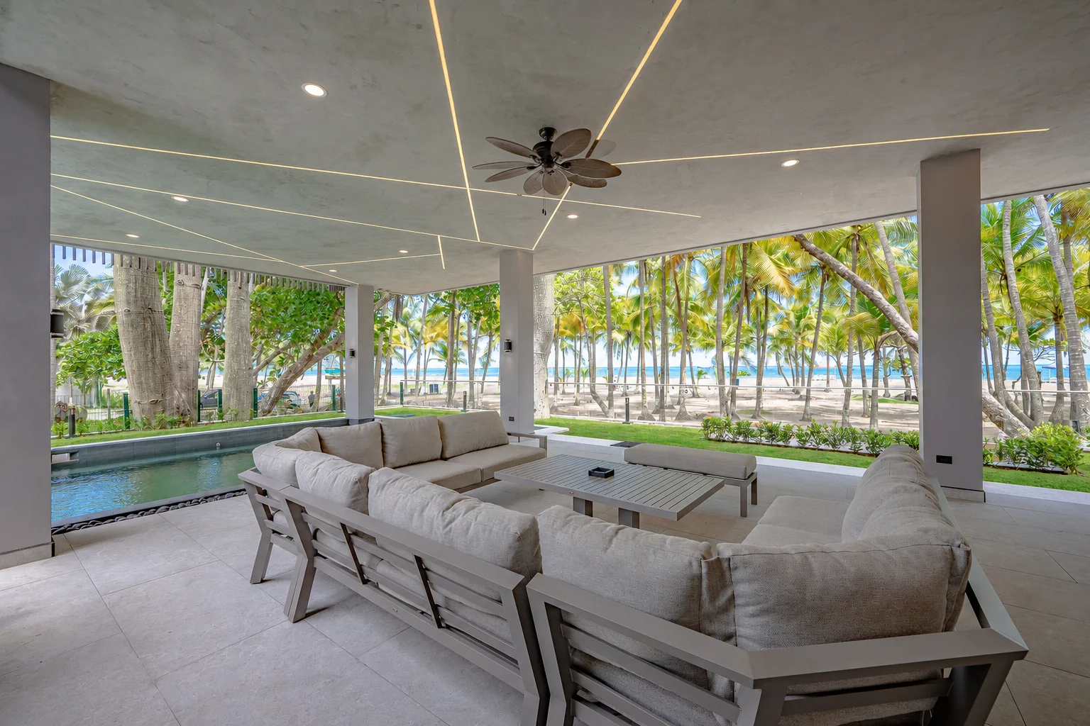Open-air beachfront lounge with the ocean beyond