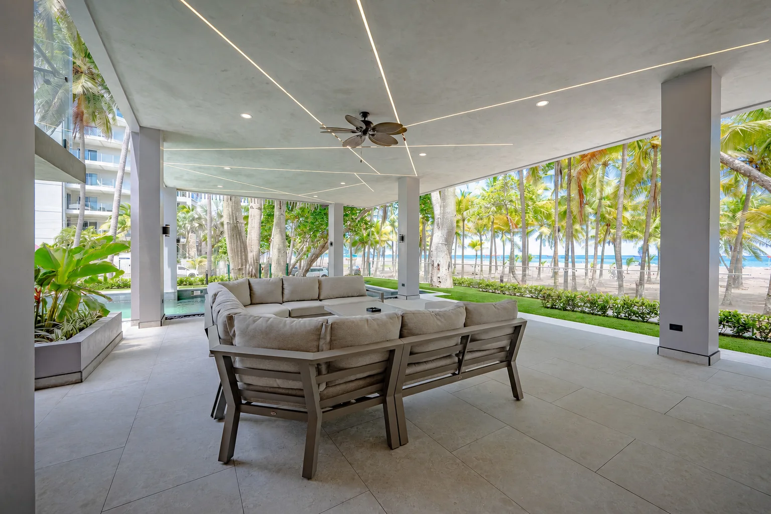 Shaded daybeds on the beachfront terrace