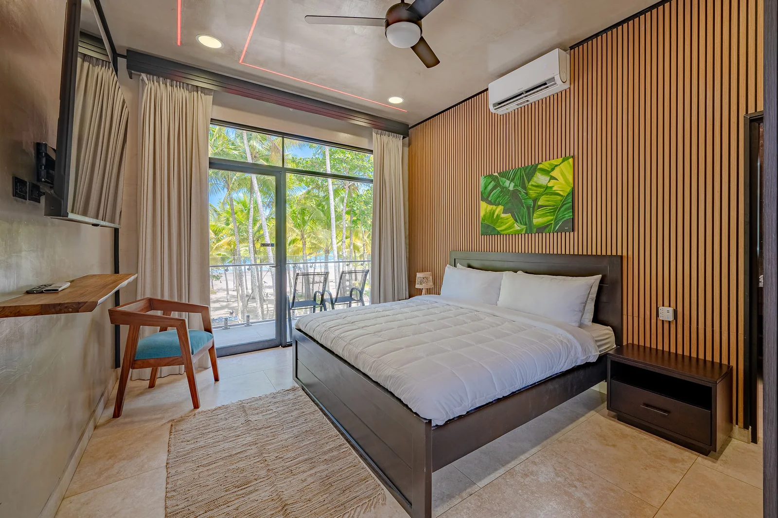 King bedroom looking out to the palm grove