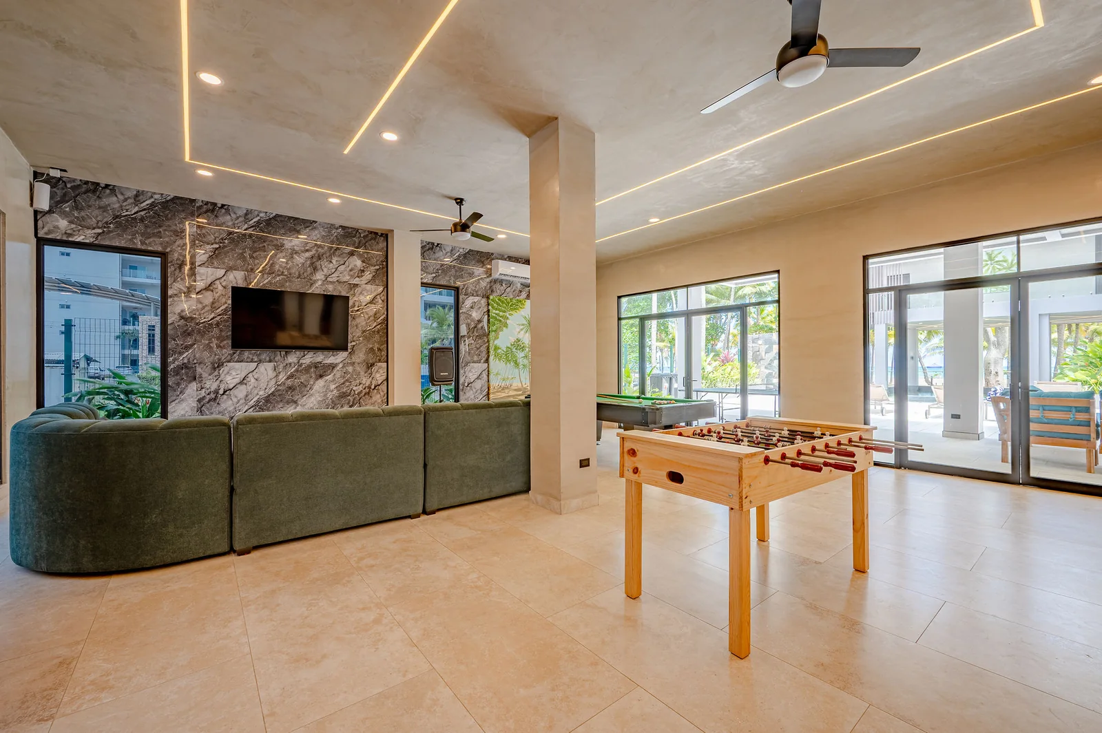 ENTERTAINMENT AREA WITH FOOSBALL, POOL TABLE AND LOUNGE SEATING